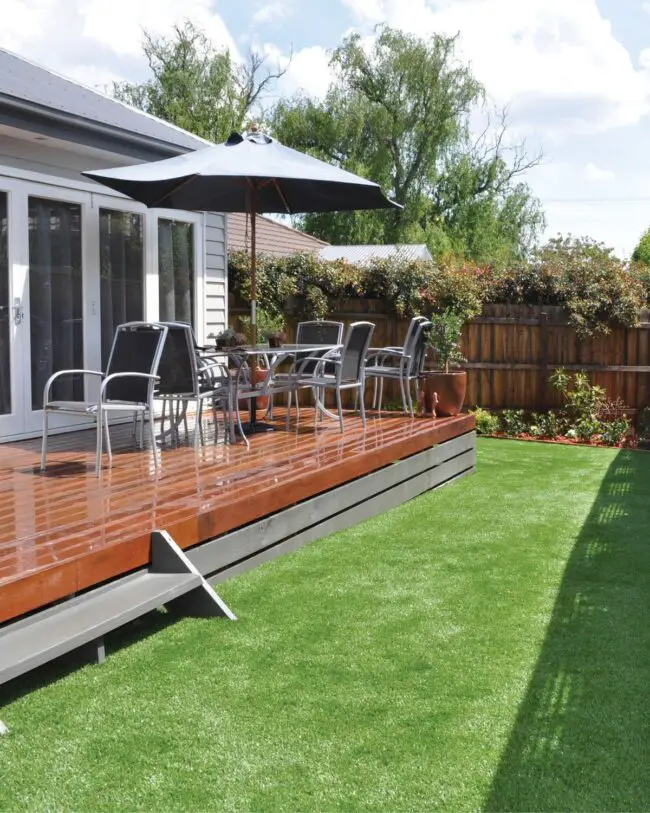 Stylish Deck Surrounded by Lush Lawn