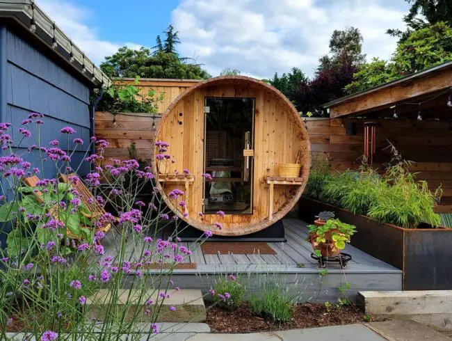 Charming Barrel Sauna Amidst Blossoming Nature