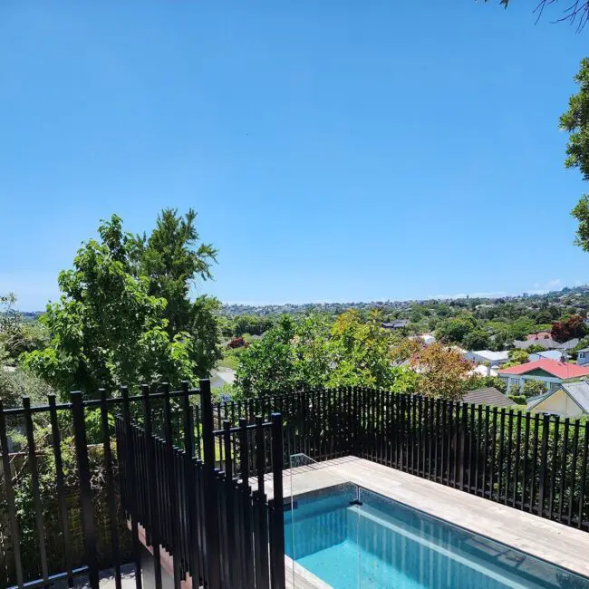 Striking Black Pool Fence Enhancing Views