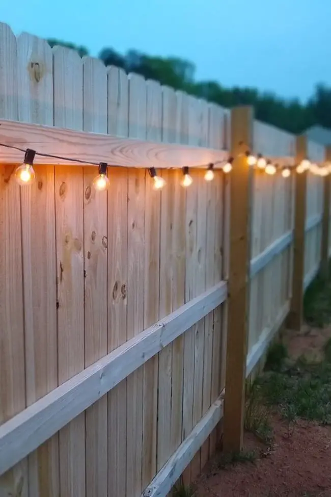 Charming Picket Fence Adorned with Lights