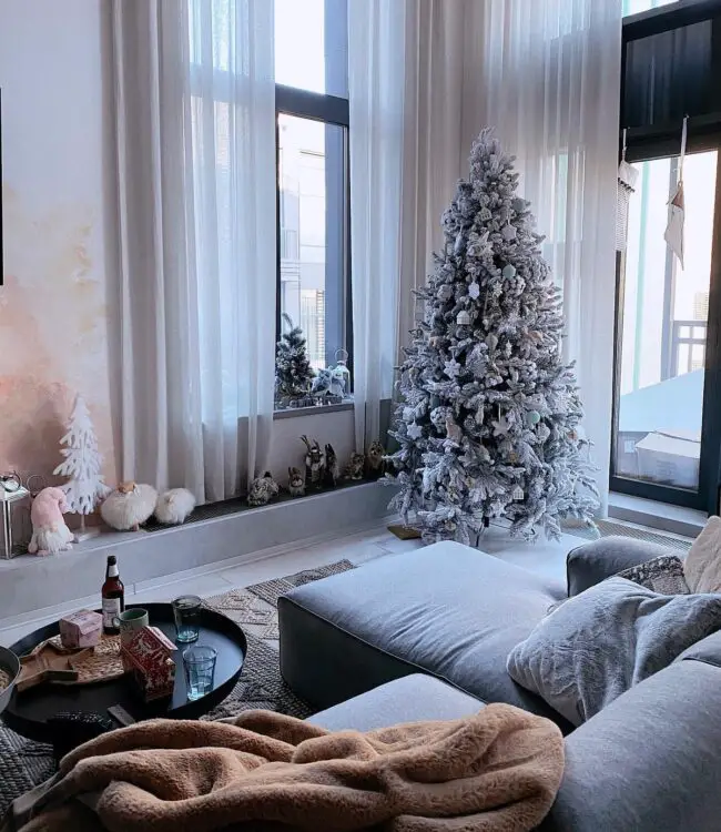 A Cozy Living Room with a Frosted Tree