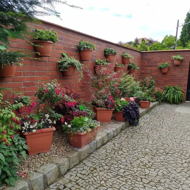 Terracotta Pots Adorning a Brick Wall