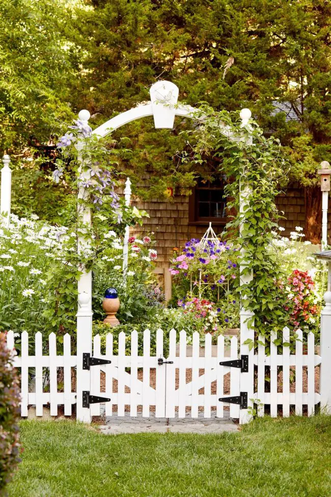 Enchanting Archway Framed by White Fence