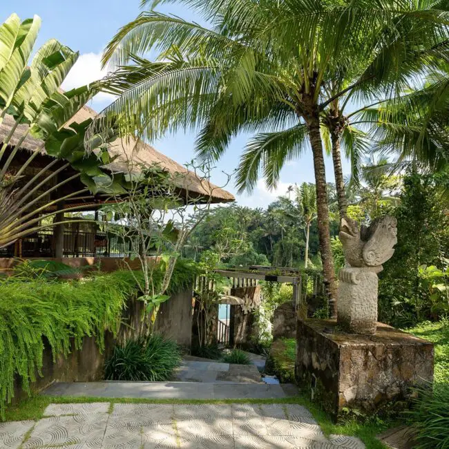 Tropical Retreat Adorned With Statues