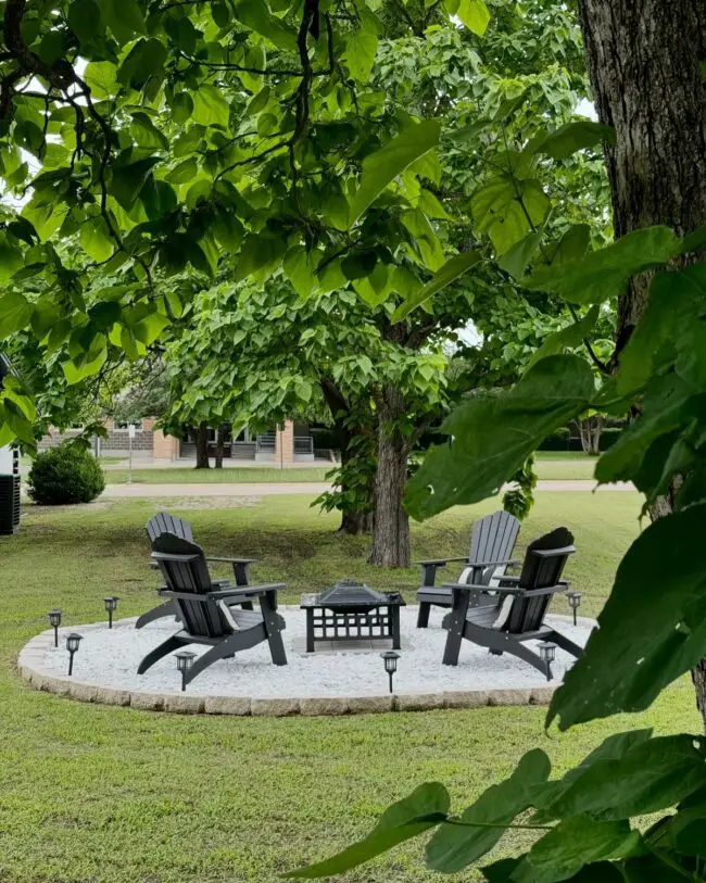 Chic Fire Pit Surrounded by Adirondack Chairs