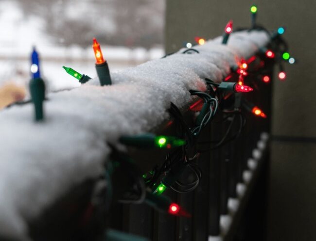 Classic Christmas Lights on a Snowy Balcony