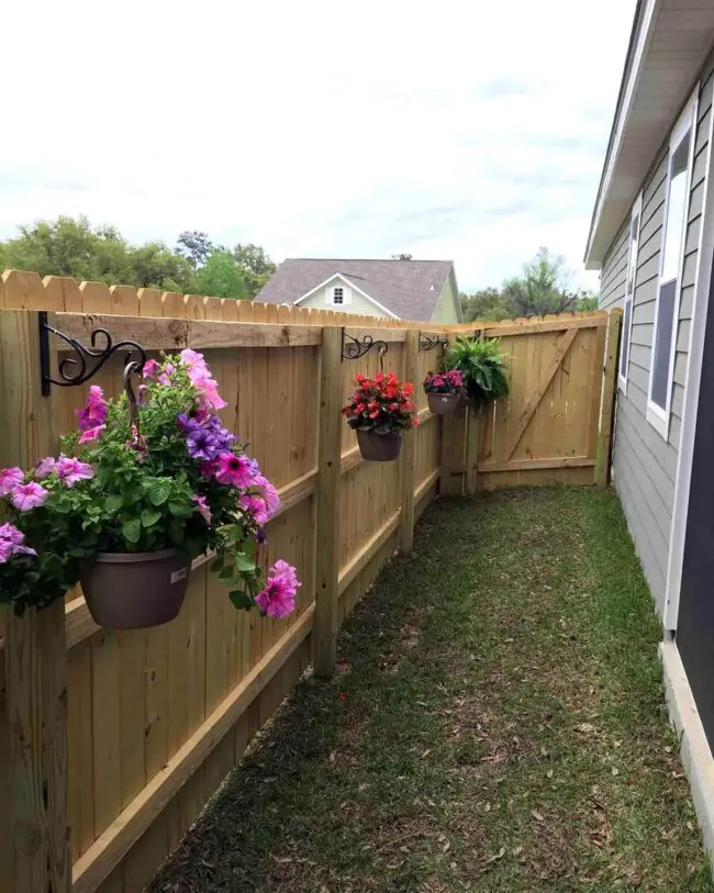 Charming Flower Pots Adorning Wooden Fence